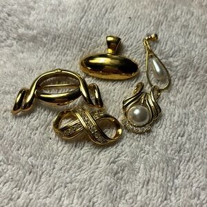 Bundle of gold tone pendants. All in like new condition set of six. 1 is Avon